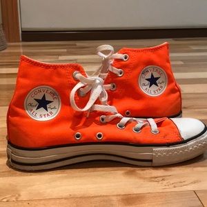 Neon orange high top Converse Chuck Taylors